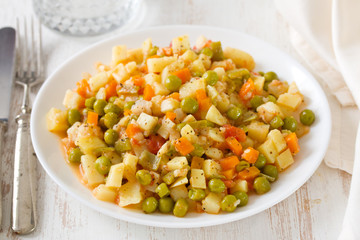 vegetables with fish on white plate