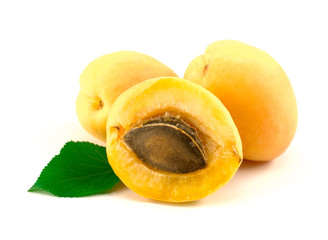 Apricots with leaves on a white background.