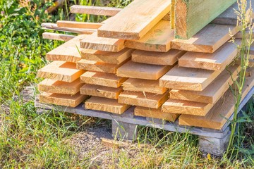 Wooden planks from sawmill for house roof construction