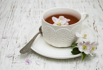 Cup of tea and spring blossom
