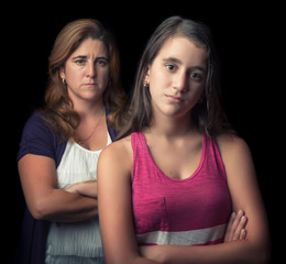 Teenage girl and her mother sad and angry