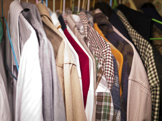 Clothes hang on a shelf