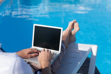 Laptop, Swimming Pool, Outdoors.