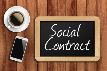 coffee, phone  and chalkboard with  word social contract