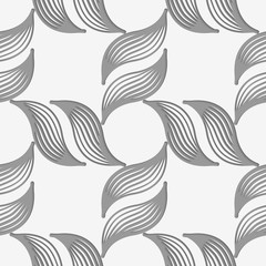 Perforated striped leafy shapes forming cross