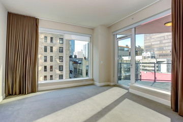 Large unfurnished bedroom with fireplace.