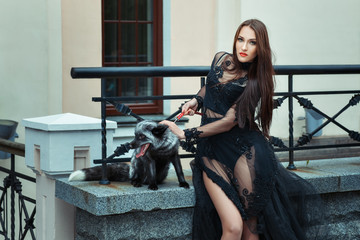 Fototapeta na wymiar Girl with a fox on the balcony.