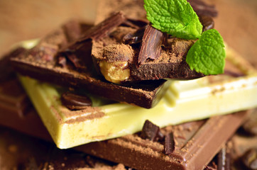 Stack of chocolate slices with cacao powder.