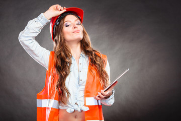 Woman structural engineer with tablet working.