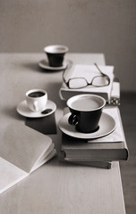 Artwork in retro style,  cup of coffee, glasses, notebook, books