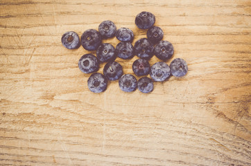 fresh and ripe blackberries in on a natural wood surface