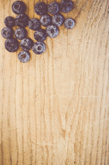 fresh and ripe blackberries on a natural wood surface