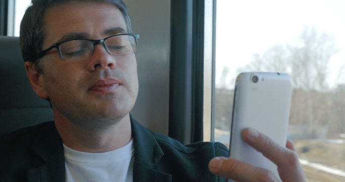 Businessman talks on skype using smartphone