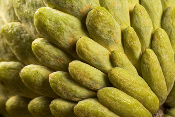 Some Sugar-Apples over a wooden table. Atemóia