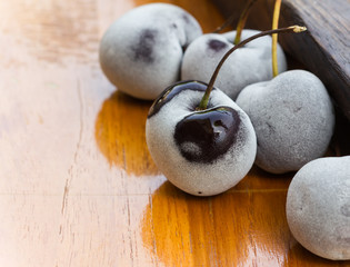 frozen cherry berries  on the wooden table