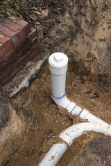 New PVC Sewer Pipe Line Installed in Trench - 87050751