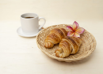 Closeup Golden brown croissant on basket 