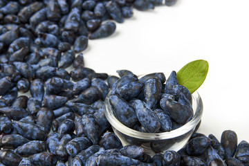 Honeysuckle berry fruits in a glass bowl