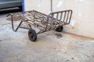 Old and dirty metal barrow