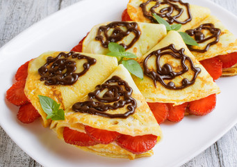 Pancakes with sliced strawberries