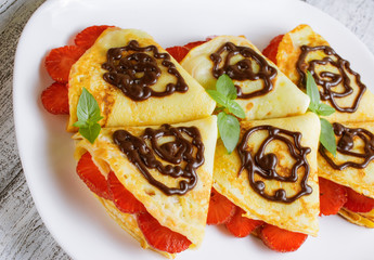 Pancakes with sliced strawberries