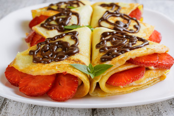 Pancakes with sliced strawberries