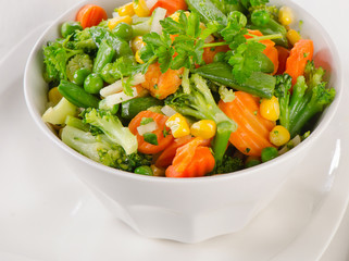 Mixed vegetables in  white bowl.