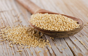 Quinoa seed closeup  on a rustic  wooden background.