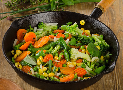 Vegetables in  a iron skillet .