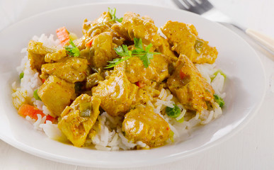 Chicken Curry and rice on a plate.