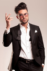 Handsome young business man showing his ring