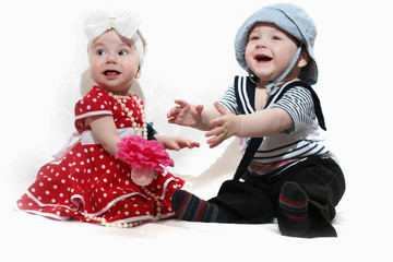 little girl in a red dress and a boy