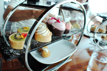 Miniature cakes on a serving stand in the restaurant the Sky Tower, Auckland