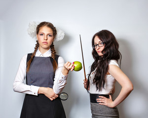 Teacher with pointer. Schoolgirl with magnifying glass and apple