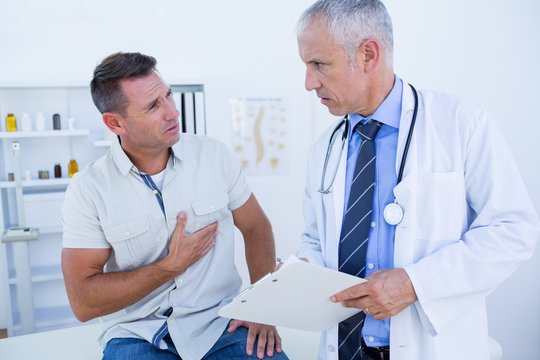 Serious Doctor Speaking With His Patient 