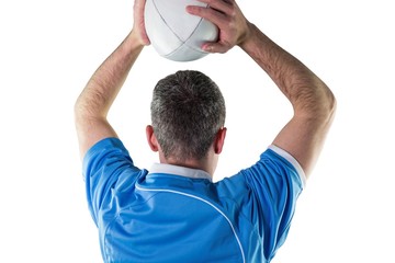 Rugby player about to throw a rugby ball