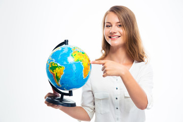 Happy girl pointing finger on globe