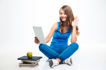 Girl sitting on the floor with tablet computer