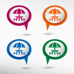 Camping and picnic table icon on colorful chat speech bubbles