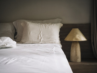 Bed sheet Matress and pillows in bedroom with Lamp Natural style