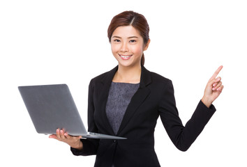 Young Businesswoman hold with notebook computer and finger point