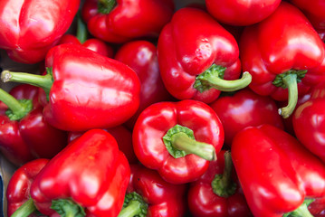 Fresh red sweet bell peppers on the market.