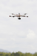 Fototapeta na wymiar Drone with camera on the sky