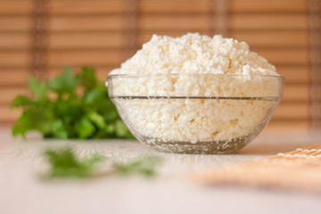 cottage cheese in a glass dish on the table