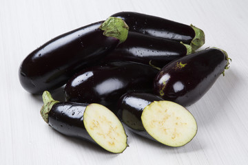 Some eggplants over a wooden surface