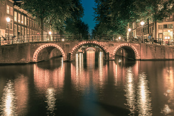 Night Amsterdam canals and seven bridges