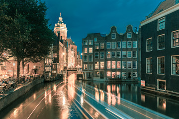 Night Amsterdam canal, church and bridge