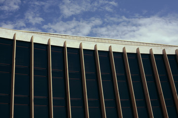 Modern glass silhouettes on modern building, sky cloud