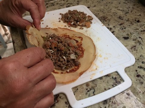 Old hands making puncake
