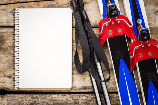 Ski background with empty paper notebook